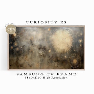 May include: A digital art print of a galaxy with gold stars and a large, bright, golden star in the center. The print is framed in a light wood frame. The text "CURIOSITY ES" is above the image and "SAMSUNG TV FRAME 3840x2160 High Resolution" is below the image.