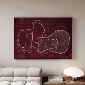 Puede incluir: Impresión artística abstracta sobre lienzo. La obra presenta un fondo rojo oscuro con formas lineales blancas y fluidas. El lienzo está enmarcado en un marco de madera marrón. El texto "CURIOSITY ES ART | HIGH QUALITY CANVAS" está en la parte inferior.
