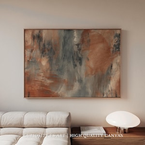 Puede incluir: Impresión en lienzo de arte abstracto con marco de madera. La obra presenta una mezcla de colores, incluyendo tonos de naranja, gris y negro, creando un efecto de textura de pincelada. El texto "CURIOSITY ES ART | HIGH QUALITY CANVAS" es visible en la parte inferior.