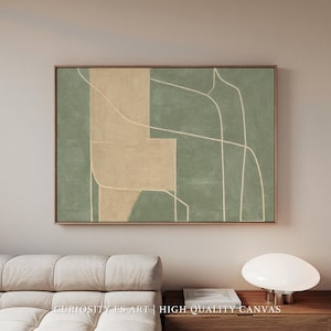 Puede incluir: Impresión artística abstracta con un diseño geométrico en tonos verde y beige apagados, enmarcada en madera natural. Líneas blancas se cruzan sobre el lienzo, creando una estética moderna y minimalista. El texto "CURIOSITY ES ART | HIGH QUALITY CANVAS" es visible.