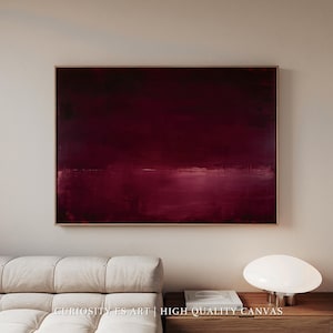 Puede incluir: Pintura abstracta enmarcada, con una paleta de colores borgoña profundos. La obra presenta una composición horizontal con sutiles variaciones de tono y textura, creando una sensación de profundidad. El texto "CURIOSITY ES ART | HIGH QUALITY CANVAS" es visible en la parte inferior.
