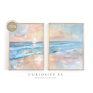 Puede incluir: Dos pinturas abstractas de un paisaje marítimo con tonos azules y rosados. Las pinturas están enmarcadas en oro y tienen un ambiente suave y de ensueño. El texto "CURIOSITY ES" y "PRINTABLE COLLECTION" está en la parte inferior de la imagen.