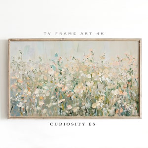 May include: A framed painting of a field of white flowers with hints of pink and green. The painting has a soft, impressionistic style and is titled "Curiosity Es".