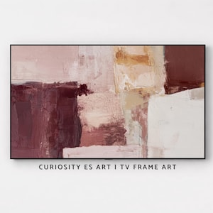Puede incluir: Obra de arte abstracta en un marco negro. La obra presenta un diseño texturizado y en capas con bloques de color en tonos burdeos, beige y blanco. El texto "CURIOSITY ES ART I TV FRAME ART" está en la parte inferior.