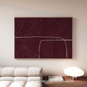 Puede incluir: Impresión artística abstracta con un fondo burdeos texturizado, una fina línea blanca y una forma curva. La obra de arte está enmarcada en un marco de madera marrón. El texto "HIGH QUALITY CANVAS" es visible en la parte inferior.