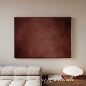 Puede incluir: Una gran obra de arte en lienzo enmarcada, de color burdeos intenso y aspecto texturizado. La obra es rectangular y está montada en un marco de madera fino y claro. El texto "CURIOSITY ES ART | HIGH QUALITY CANVAS" se encuentra en la parte inferior.