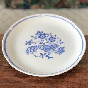 Earthenware plate from Moulin des Loups, Orchies, France, decorated with a blue bird, 24 cm diameter