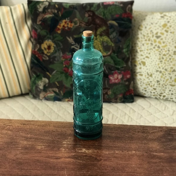 Straight blue bottle with short neck in molded glass