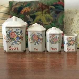 Set of 4 fine earthenware spice jars with multicolored floral decoration, circa 1930