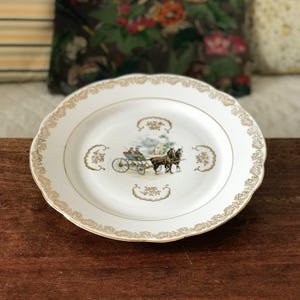 Round and flat porcelain serving dish attribution du Berry carriage decor