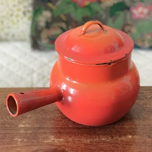 Tall fondue pot or casserole dish with orange enameled metal lid