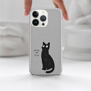 May include: A gray phone case featuring a black cat illustration with the text "what the fuck". The cat is sitting upright with large white eyes. The phone case has a camera and flash cutout.