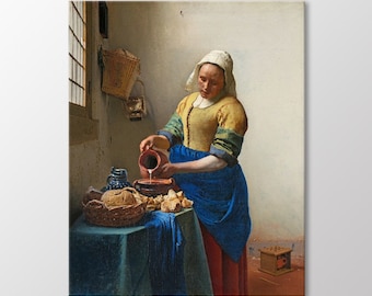 May include: A woman in a yellow and blue dress pours milk from a brown jug into a bowl on a table with a basket of bread. The scene is set in a kitchen with a window and a basket hanging on the wall.