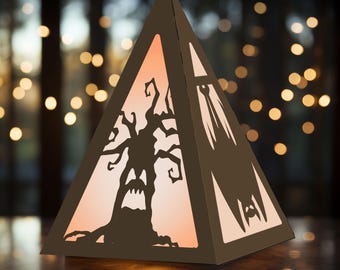 May include: A brown, pyramid-shaped Halloween decoration with cut-out silhouettes of a spooky tree and bats. The interior glows with an orange light, creating a festive and eerie ambiance. Perfect for adding a touch of Halloween spirit to any space.