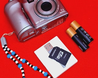 OLYMPUS SP-310 7.1MP Digital Camera with 3x Optical Zoom (Silver)