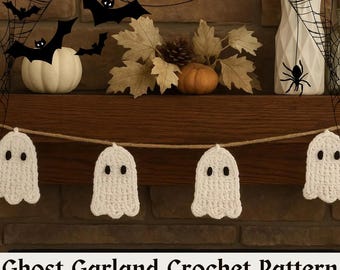 May include: A white crochet ghost garland with black eyes hangs in front of a fireplace mantel decorated for Halloween. The mantel features a white pumpkin, fall leaves, and a vase with a spider web design. The text "Ghost Garland Crochet Pattern" is at the bottom.