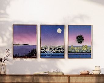May include: Three framed prints of a cityscape at night with a pool in the foreground. The first print shows a sunset over the ocean, the second print shows a full moon in the sky, and the third print shows a palm tree in the foreground.