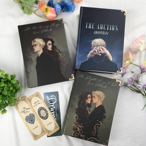 May include: Four hardcover books with illustrations and gold corner accents. The book covers feature illustrations of people and titles such as "All The Wrong Things," "The Auction," and "The Right Thing To Do." Also included are three bookmarks.