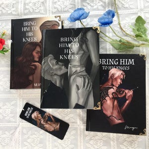 May include: Multiple copies of a book titled "Bring Him to His Knees" are shown, with illustrations of figures in different poses. A bookmark with the same title and artwork is also present. The books have black covers with gold corner details.