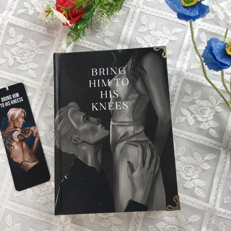 May include: A book and bookmark with a grayscale illustration. The book cover reads "BRING HIM TO HIS KNEES" with an image of a person kneeling before another. The bookmark features a similar illustration and text.