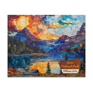 May include: A mosaic-style illustration of a mountain lake scene with a sunset sky, a mountain range, and a forest. The text "Glacier National Park" and "Wilsons 2024" is on a brown sign in the bottom right corner.