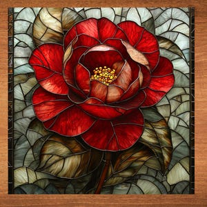 May include: A stained glass artwork depicting a red camellia flower with green leaves. The flower is in the center of the image and is surrounded by leaves. The artwork is made up of small pieces of glass that are arranged in a mosaic pattern.