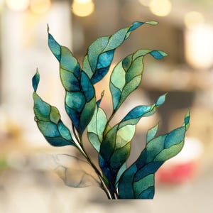 May include: An artistic depiction of stylized leaves in shades of teal, turquoise, and green. The leaves have a mosaic-like appearance with gold outlines, creating a stained-glass effect. The image has a soft, blurred background.