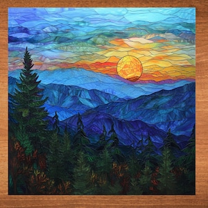 May include: Stained glass art piece depicting a mountain landscape at sunset. The artwork features a vibrant orange sun, blue mountains, and a forest of green trees. The sky transitions from blue to orange.