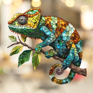 May include: A stained glass chameleon with a green, blue, and orange mosaic pattern, perched on a branch with green leaves.