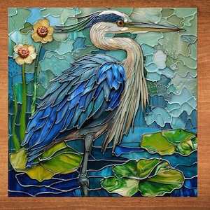May include: A stained glass artwork depicting a blue heron standing in a pond with lily pads. The heron has a long neck and beak, and its feathers are a mix of blue, green, and brown. The pond is a vibrant blue, and the lily pads are green with yellow accents.