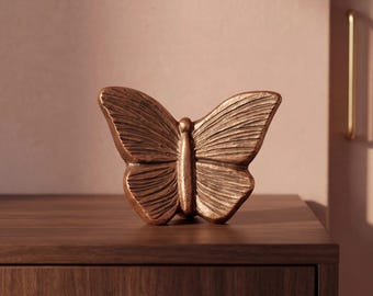Urna de lembrança em forma de borboleta para cinzas em bronze.