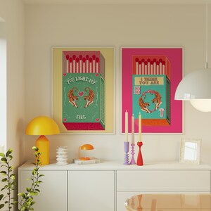 May include: Two colorful framed prints with a matchbox design and tiger illustrations. The text on the prints reads "You light my fire" and "I think you are hot".