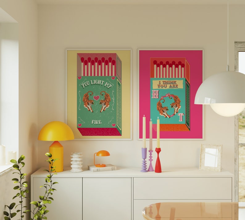 May include: Two colorful framed prints with a matchbox design and tiger illustrations. The text on the prints reads "You light my fire" and "I think you are hot".