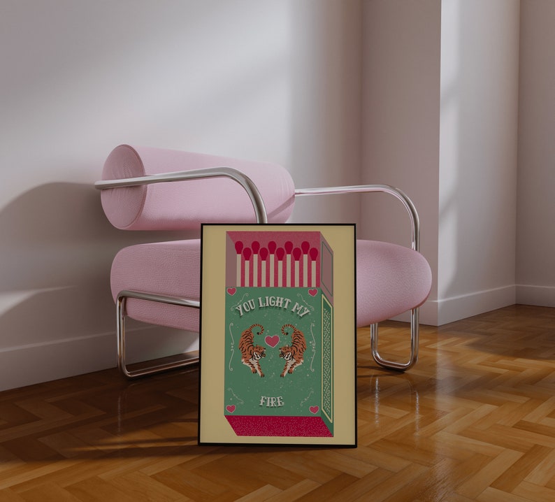 May include: A green and yellow matchbox with a red heart and two orange tigers. The text on the matchbox reads "You light my fire."