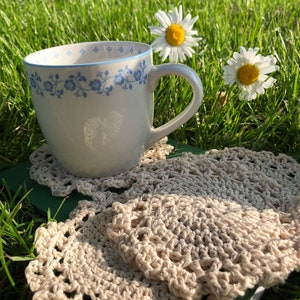 Natural colored crocheted four piece coaster set