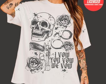 May include: White t-shirt with a black and white graphic design featuring a skull, roses, handcuffs, a gun, and the text "I vow you vow we vow".