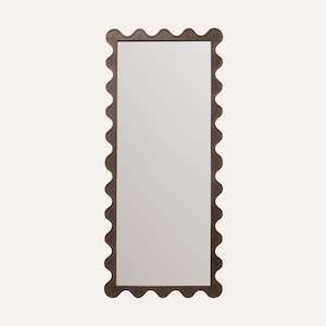 May include: A rectangular mirror with a dark brown, wavy frame. The mirror has a simple, clean design, suitable for various interior styles. The frame's unique shape adds a decorative element to the wall decor.