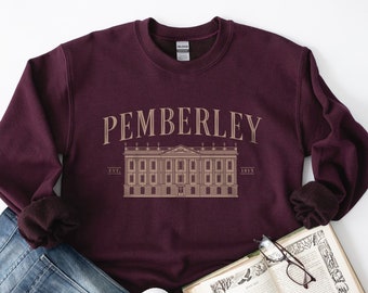May include: A maroon sweatshirt with a graphic print of a building with the text "PEMBERLEY EST. 1813" on the front.