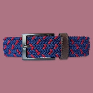 May include: A braided belt with a dark blue and red woven pattern and a black buckle.