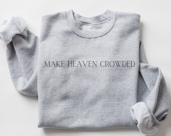 May include: Grey sweatshirt with the text "MAKE HEAVEN CROWDED" printed on the front.