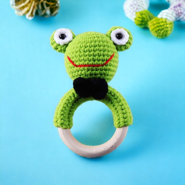 Crochet baby rattle with grip ring made of beech wood green crochet frog rattle with bell ring
