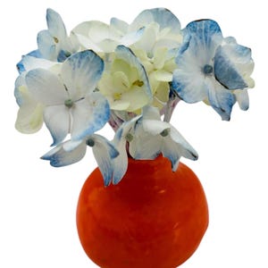 May include: A set of three ceramic mugs with a speckled, matte finish. The mugs are in shades of cream, light gray, and dark gray. Each mug has a simple, modern design and a rounded handle. Perfect for coffee or tea.