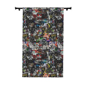 May include: A black and white curtain with a colorful pattern of stickers and logos. The pattern includes words like "Black Sabbath", "The Damned", "The Clash", and "Sex Pistols".