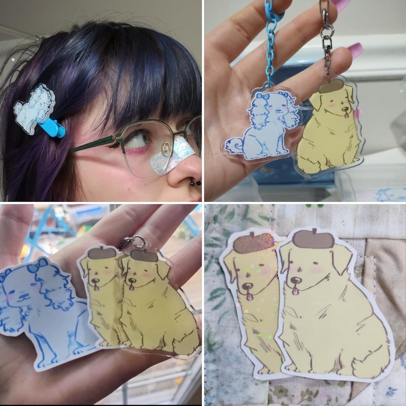 May include: Two sets of dog charm keychains. One set features two white dogs with blue bows and the other set features two yellow dogs with brown hats. The charms are made of clear acrylic and have a sparkly finish.