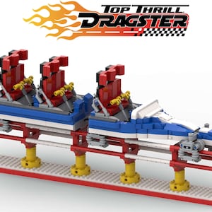 May include: A Lego model of a roller coaster called "Top Thrill Dragster". The coaster is blue, white, and red with three red seats. The coaster is on a track with red and white supports.