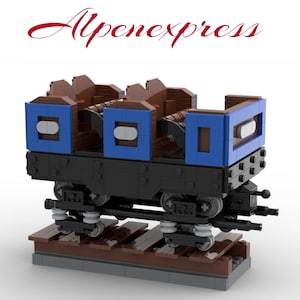 May include: A blue and brown Lego train car with the words "Alpenexpress" printed on the top. The car has four seats and is on a track.