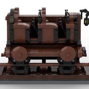 Puede incluir: Un vag&oacute;n de tren de madera marr&oacute;n con detalles negros y una linterna en el lateral. El vag&oacute;n tiene cuatro asientos y est&aacute; sobre una v&iacute;a.