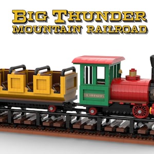 May include: A red, green, and black Lego train with a yellow passenger car. The train is labeled "L.R. COURAGEOUS" and "BIG THUNDER MOUNTAIN RAILROAD".