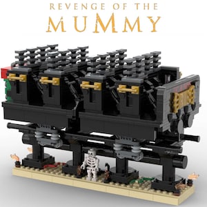 May include: A black LEGO model of the Revenge of the Mummy roller coaster ride at Universal Studios. The coaster train has several black cars with gold accents and a skeleton figure stands in front of the train.
