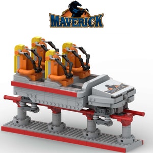 May include: A Lego model of the Maverick roller coaster at Cedar Point amusement park. The coaster train is gray with orange and yellow seats and black restraints. The train is on a red track and has the word "Maverick" on the side.